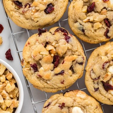 We love everything about these cookies, the amazing combination of cranberries, walnuts, and white chocolate, they have the perfect texture and thickness. These disappear quickly every time we make them. Here they are pictured close together cooling on a cooling rack.