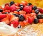 Dutch Baby Pancake with Macerated Berries and Whipped Cream