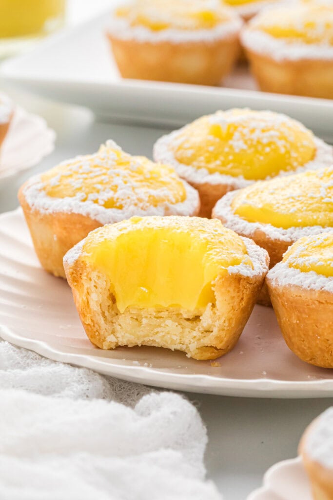 This lemon curd is the Best Lemon Curd Recipe with its rich, creamy custard and its perfect balance of sweet and tart. We love using this as a breakfast spread, as a filling for cookies and tarts, and as a topping with berries and whipped cream. It is absolutely irresistible and is the perfect, cheerful spring accompaniment to a variety of dishes and desserts. In this image